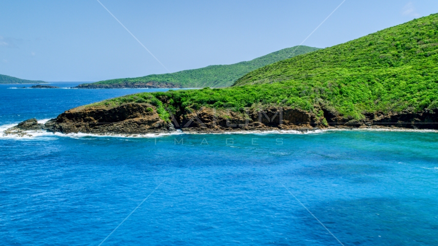 Sapphire blue waters and a rugged island coastline, Culebra, Puerto Rico  Aerial Stock Photo AX102_115.0000000F | Axiom Images