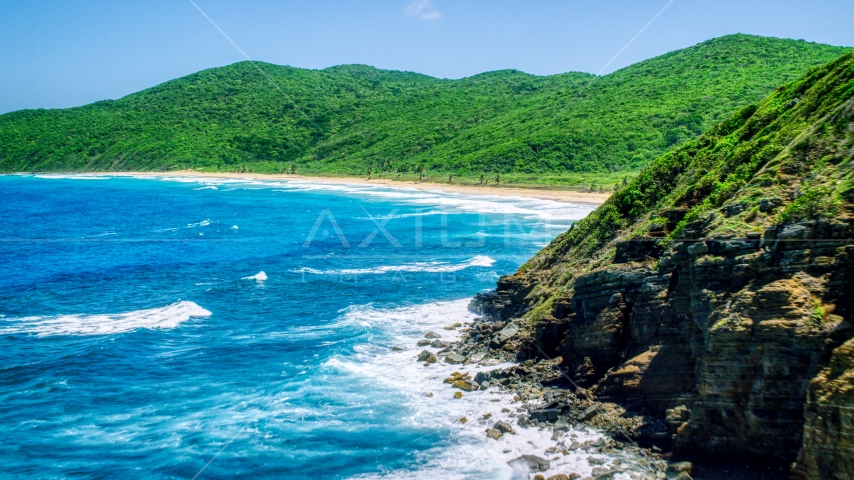 Sapphire blue waters and a Caribbean beach and lush vegetation, Culebra, Puerto Rico  Aerial Stock Photo AX102_116.0000040F | Axiom Images