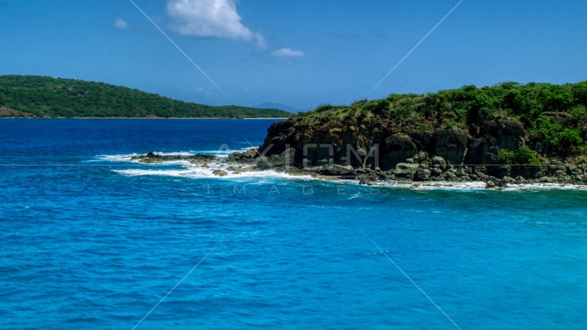 Sapphire blue waters and a rugged island coast in Culebra, Puerto Rico Aerial Stock Photo AX102_126.0000000F | Axiom Images