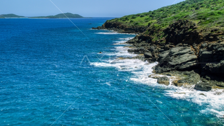 Sapphire blue waters and a rugged island coast, Culebra, Puerto Rico  Aerial Stock Photo AX102_128.0000116F | Axiom Images