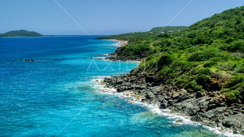 A coast with vegetation and sapphire blue waters, Culebra, Puerto Rico  Aerial Stock Photo AX102_129.0000222F | Axiom Images