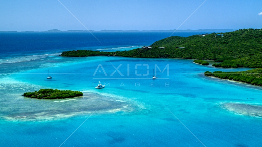 Fishing boat and sailboats in turquoise blue waters along the island coast, Culebra, Puerto Rico  Aerial Stock Photo AX102_136.0000000F | Axiom Images