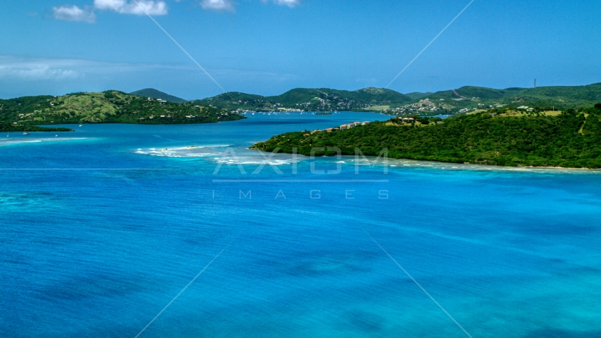 Hilltop homes overlooking sapphire blue waters near a coastal town, Culebra, Puerto Rico  Aerial Stock Photo AX102_138.0000238F | Axiom Images