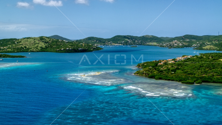 Small island town and a bay with tropical blue water in Culebra, Puerto Rico  Aerial Stock Photo AX102_139.0000214F | Axiom Images