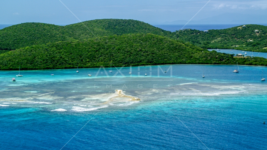 Sailboats in turquoise waters beside a tree covered island coast, Culebra, Puerto Rico  Aerial Stock Photo AX102_140.0000000F | Axiom Images