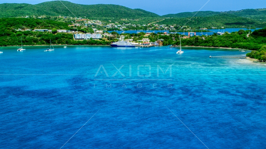 Ferry in the sapphire blue bay by a coastal town, Culebra, Puerto Rico  Aerial Stock Photo AX102_148.0000000F | Axiom Images