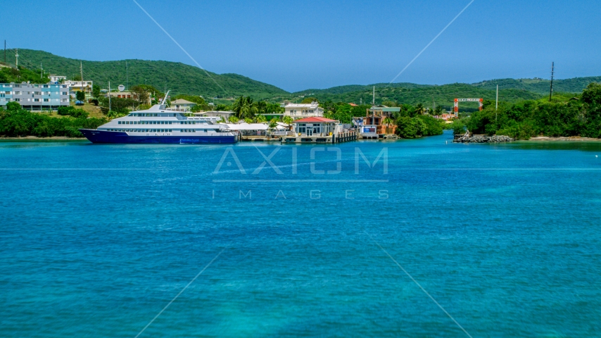 Docked ferry in sapphire blue bay by the coast, Culebra, Puerto Rico  Aerial Stock Photo AX102_149.0000236F | Axiom Images