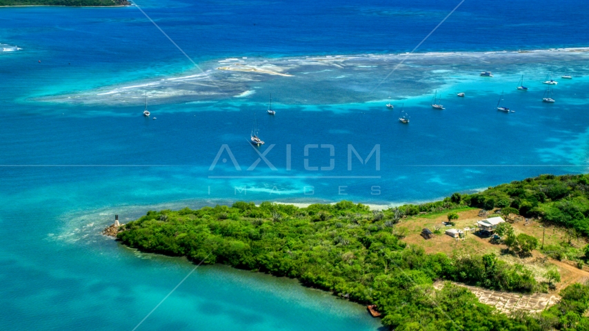 Sailboats near a reef in sapphire blue waters of a harbor Culebra, Puerto Rico  Aerial Stock Photo AX102_159.0000283F | Axiom Images