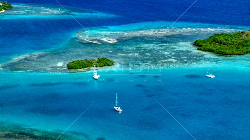 Boats near a reef in turquoise Caribbean waters, Culebra, Puerto Rico Aerial Stock Photo AX102_172.0000000F | Axiom Images