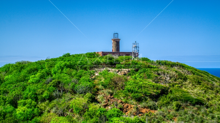 The Culebrita Lighthouse on a Caribbean island hilltop, Puerto Rico  Aerial Stock Photo AX102_178.0000000F | Axiom Images