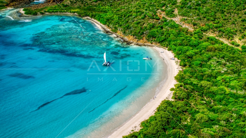 Boats beside a white sand beach on the Caribbean island of Culebrita, Puerto Rico  Aerial Stock Photo AX102_180.0000000F | Axiom Images