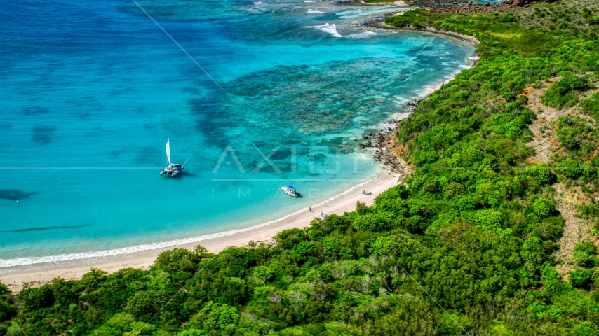 Pair of boats beside a white sand beach on the Caribbean island of Culebrita, Puerto Rico  Aerial Stock Photo AX102_180.0000255F | Axiom Images