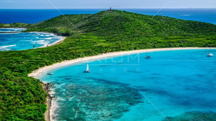 Catamarans in turquoise blue waters beside a white sand Caribbean beach, Culebrita, Puerto Rico  Aerial Stock Photo AX102_182.0000000F | Axiom Images