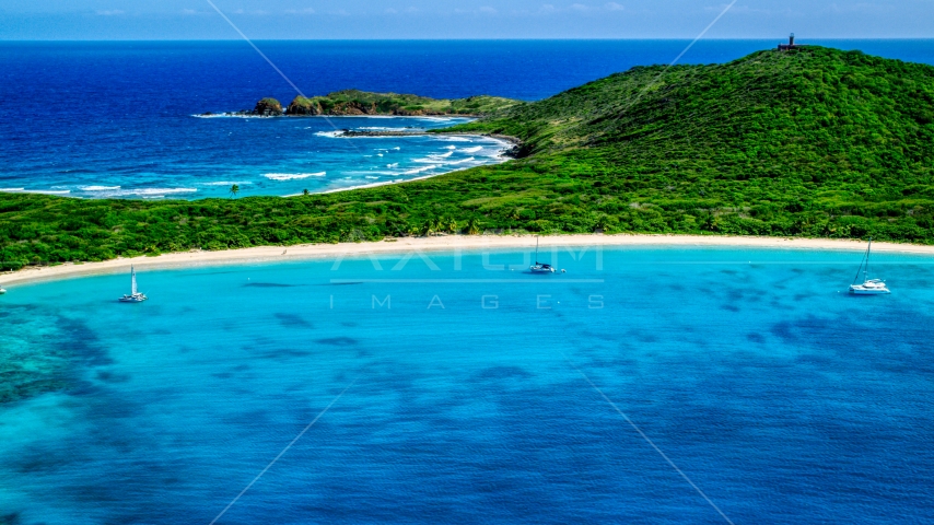 Catamarans in turquoise blue waters beside a white sand Caribbean beach, Culebrita, Puerto Rico  Aerial Stock Photo AX102_182.0000258F | Axiom Images