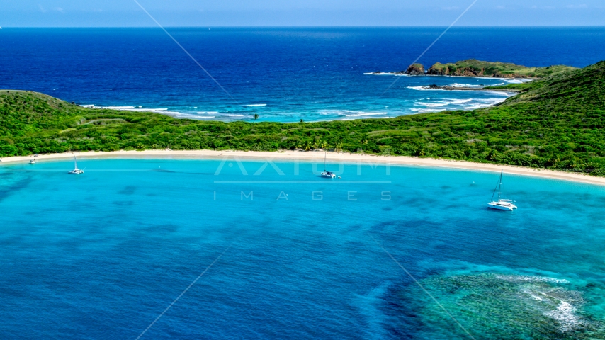 Catamarans anchored by a white sand Caribbean beach, Culebrita, Puerto Rico Aerial Stock Photo AX102_183.0000131F | Axiom Images