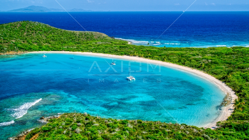 Catamarans in turquoise waters beside a white sand Caribbean beach, Culebrita, Puerto Rico Aerial Stock Photo AX102_184.0000156F | Axiom Images