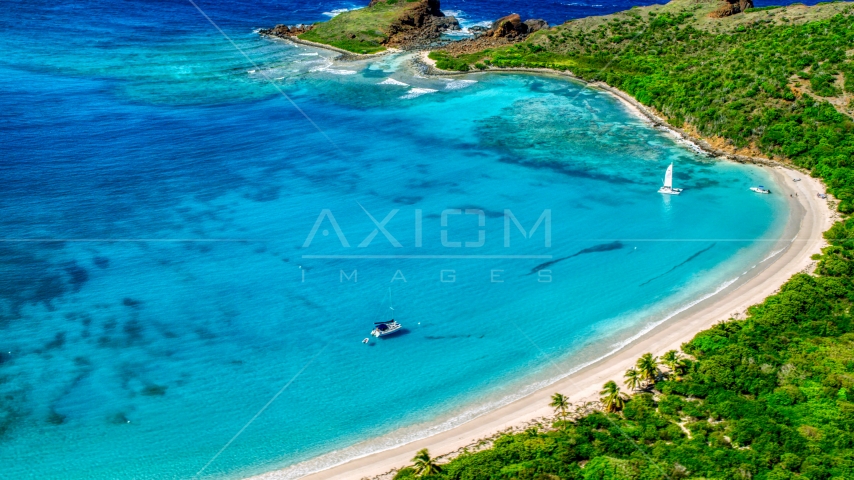 Catamarans beside a Caribbean island beach in Culebrita, Puerto Rico Aerial Stock Photo AX102_187.0000000F | Axiom Images