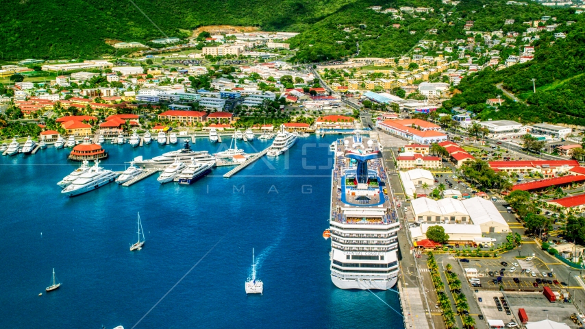 Cruise ship and yachts docked in sapphire waters at a Caribbean island town, Charlotte Amalie, St. Thomas  Aerial Stock Photo AX102_210.0000000F | Axiom Images