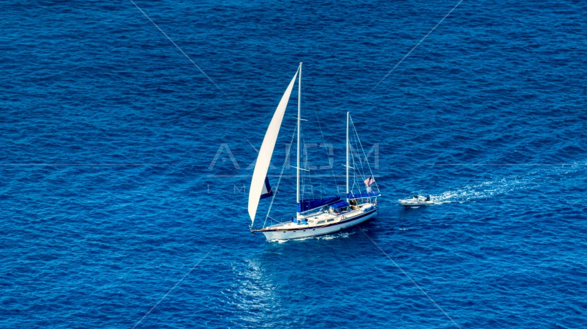 Sailboat in sapphire blue waters, St Thomas, USVI  Aerial Stock Photo AX102_255.0000094F | Axiom Images