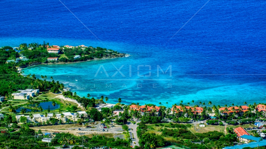 Condominium resort beside sapphire blue Caribbean waters, East End, St Thomas Aerial Stock Photo AX102_257.0000099F | Axiom Images