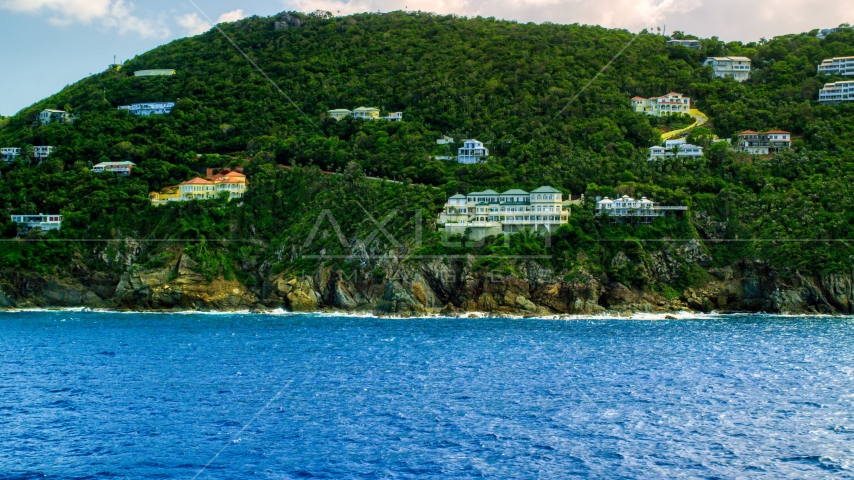 Hillside oceanfront mansions on a Caribbean island, Northside, St Thomas, the US Virgin Islands  Aerial Stock Photo AX102_262.0000315F | Axiom Images