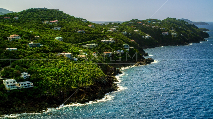 Hillside mansions on an island coast overlooking the ocean, Northside, St Thomas  Aerial Stock Photo AX102_267.0000000F | Axiom Images