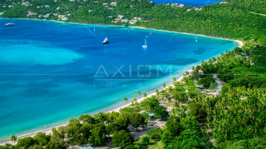 White sand Caribbean beach and turquoise blue waters with sailboats, Magens Bay, St Thomas Aerial Stock Photo AX102_272.0000000F | Axiom Images