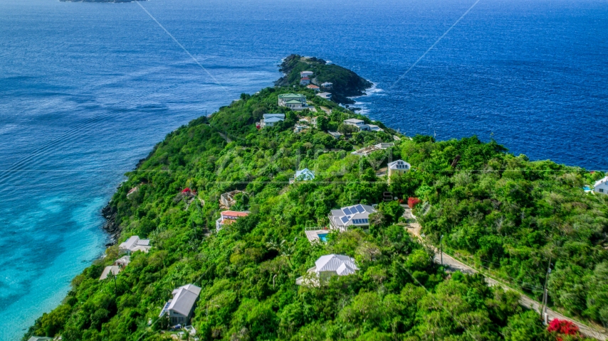Upscale hilltop homes overlooking Caribbean waters, Magens Bay, St Thomas Aerial Stock Photo AX102_276.0000000F | Axiom Images