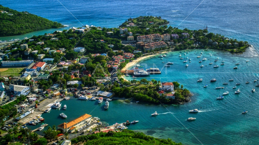 Resort beside the Caribbean blue harbor in Cruz Bay, St John Aerial Stock Photo AX103_023.0000175F | Axiom Images