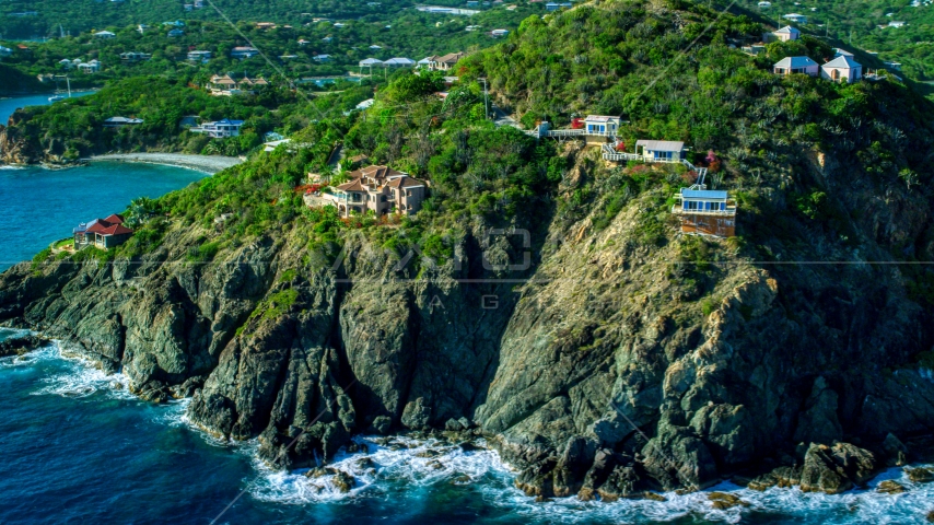 Cliff top mansions above sapphire blue Caribbean waters, Cruz Bay, St John Aerial Stock Photo AX103_036.0000000F | Axiom Images