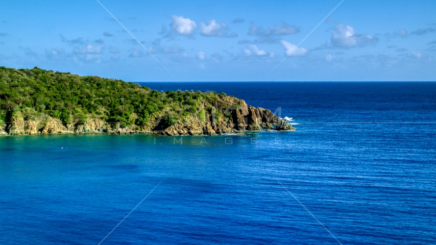 A tree covered rugged coast along blue waters of Great Lameshur Bay, St John Aerial Stock Photo AX103_056.0000115F | Axiom Images