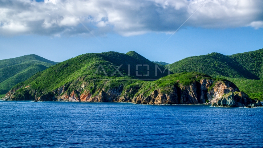 Coastal cliffs and jungle along sapphire blue Caribbean waters, Central, St John Aerial Stock Photo AX103_057.0000000F | Axiom Images