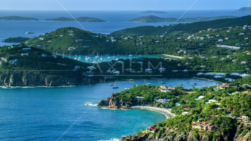 Hilltop and cliff top mansions along Caribbean blue waters, Cruz Bay, St John Aerial Stock Photo AX103_060.0000202F | Axiom Images