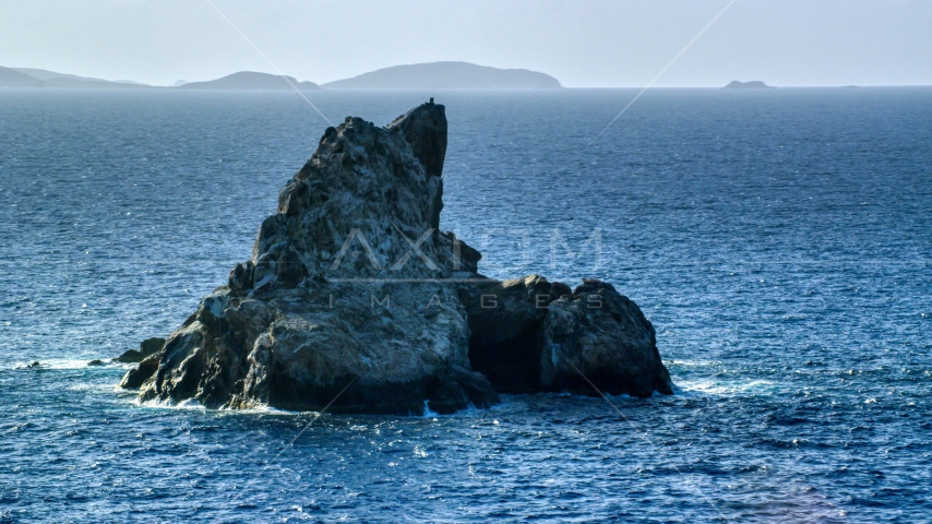 Rock formation in Caribbean blue waters, St Thomas Aerial Stock Photo AX103_081.0000028F | Axiom Images