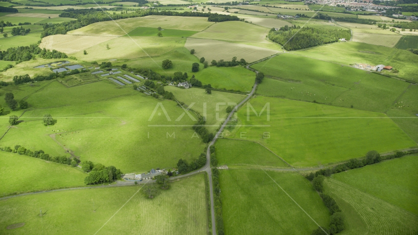 Farms and green farm fields in Stirling, Scotland Aerial Stock Photo AX109_010.0000000F | Axiom Images