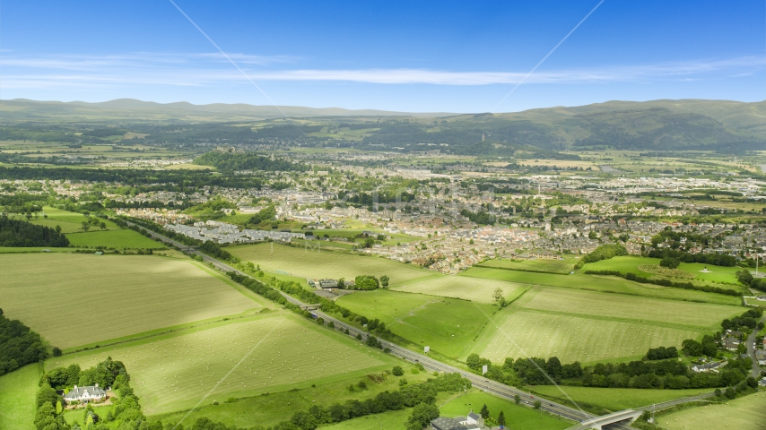Farm fields near rural homes, Stirling, Scotland Aerial Stock Photo AX109_013.0000000F | Axiom Images