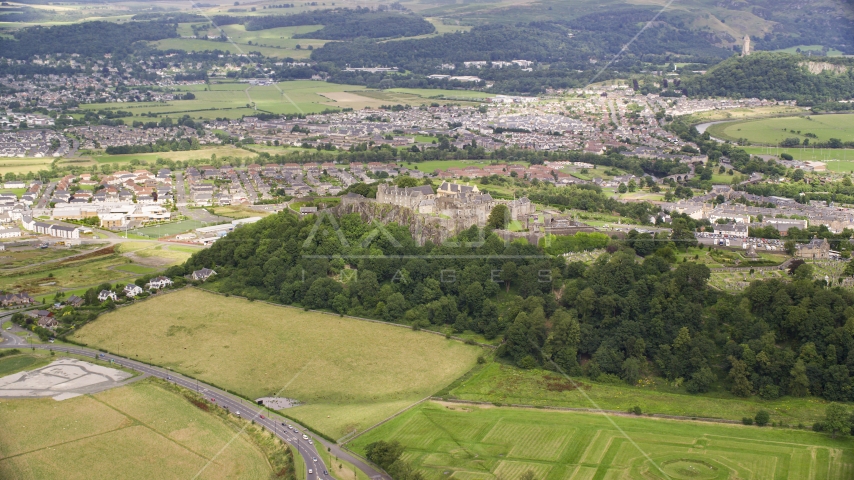 Hilltop Stirling Castle by residential neighborhoods, Stirling, Scotland Aerial Stock Photo AX109_016.0000000F | Axiom Images