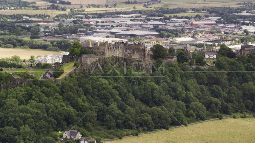 A view of historic Stirling Castle on a hill in Scotland Aerial Stock Photo AX109_021.0000170F | Axiom Images