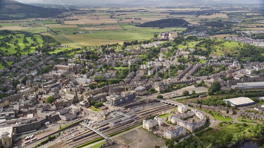 Historic Stirling Castle seen from apartment buildings, Scotland Aerial Stock Photo AX109_028.0000013F | Axiom Images