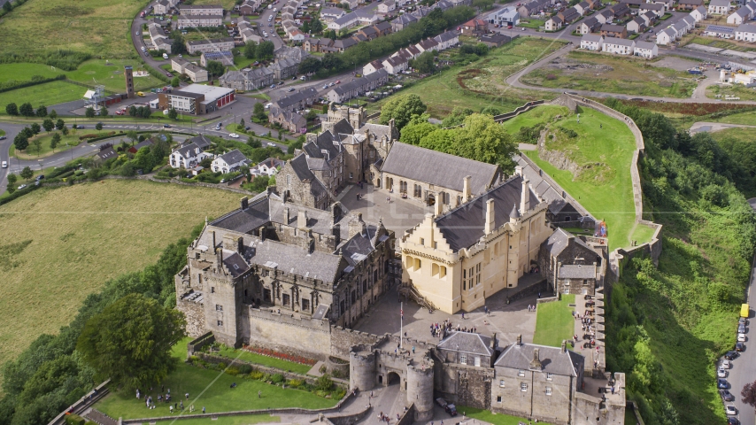 Iconic Stirling Castle and grounds on a hill, Scotland Aerial Stock Photo AX109_036.0000000F | Axiom Images