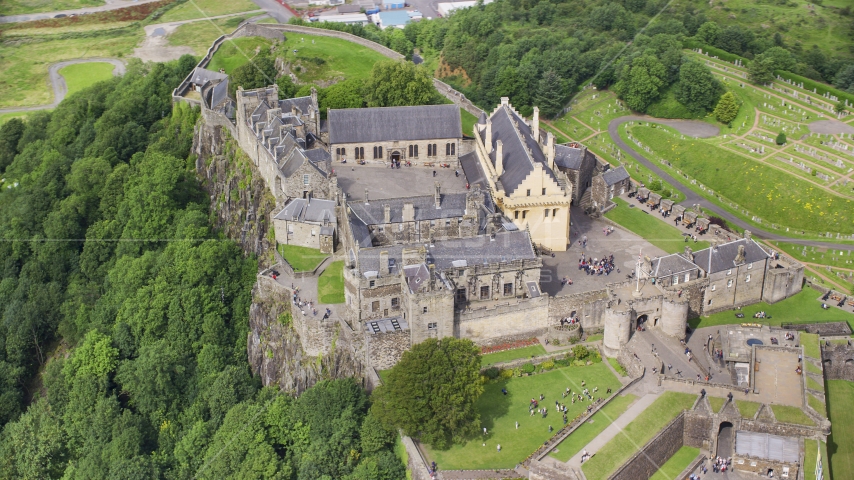 Historic Stirling Castle with tourists, Scotland Aerial Stock Photo AX109_040.0000000F | Axiom Images