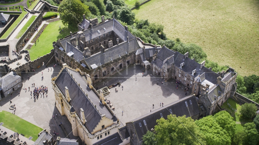 The historic Stirling Castle and grounds with tourists, Scotland Aerial Stock Photo AX109_042.0000106F | Axiom Images