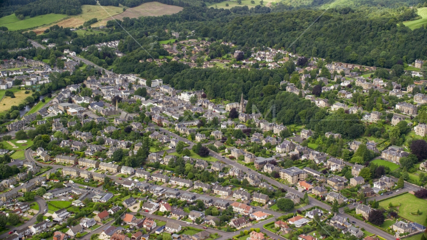 A residential neighborhood with trees in Stirling, Scotland Aerial Stock Photo AX109_056.0000000F | Axiom Images