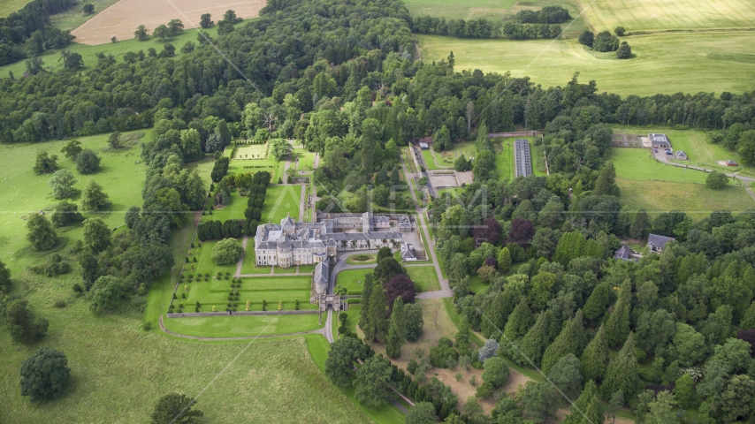 Keir House surrounded by trees, Scotland Aerial Stock Photo AX109_060.0000000F | Axiom Images