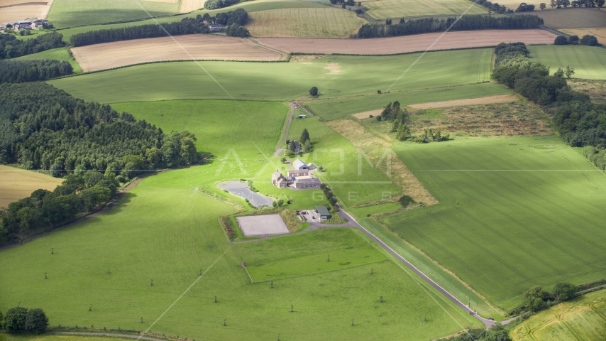 A sheep farm and green fields in Stirling, Scotland Aerial Stock Photo AX109_061.0000000F | Axiom Images
