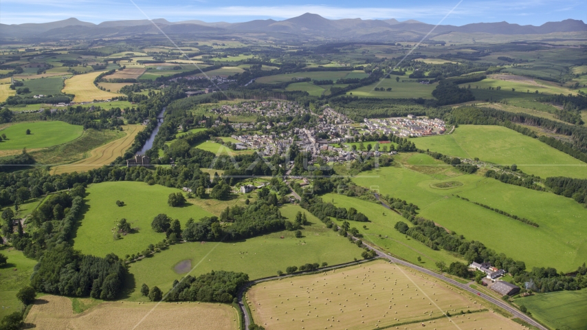 A rural village beside green farmland, Duone, Scotland Aerial Stock Photo AX109_065.0000000F | Axiom Images