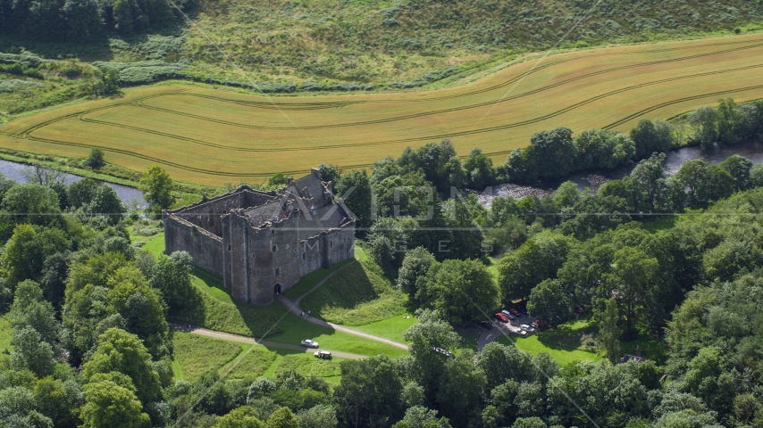 A view of Doune Castle with trees, Scotland Aerial Stock Photo AX109_067.0000000F | Axiom Images