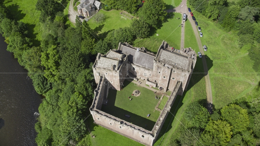 A bird's eye view of historic Doune Castle and its grounds, Scotland Aerial Stock Photo AX109_072.0000120F | Axiom Images