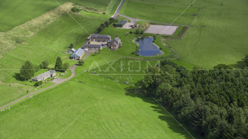 A sheep farm and pond, Stirling, Scotland Aerial Stock Photo AX109_091.0000000F | Axiom Images