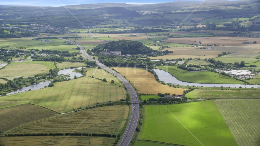 M9 highway and farmland in Stirling, Scotland Aerial Stock Photo AX109_096.0000000F | Axiom Images